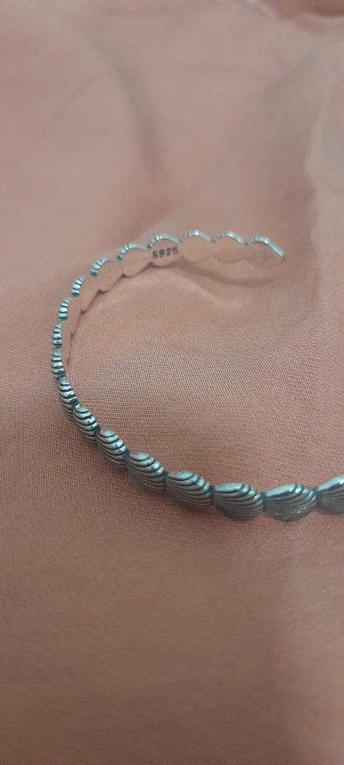 Silver Shell Pattern Cuff Bracelet (Category: Bracelets) located in Singapore. Submitted by lalaine83 (Listing ID 1456189704, Image 2). Description: - Cool silver cuff bracelet - Features a repeating shell pattern - Open cuff design for easy wear - Versatile accessory for any outfit - marked 925.