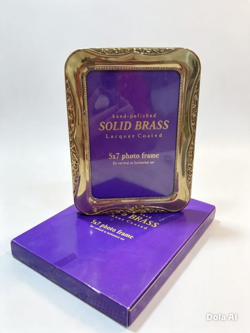 Solid Brass 5" × 7" Photo Frame – Hand Polished, Lacquer Coated (Category: Frames & Pictures) located in Paranaque City. Submitted by gentle.declutter (Listing ID 1456123771, Image 1). Description: 📏 Size: Holds 5" × 7" photo Material: Solid brass — hand-polished, lacquer-coated finish to resist tarnishing; substantial weight & warm golden glow Design: Ornate embossed scrollwork along top & curved edges — classic vintage elegance, smooth polishe