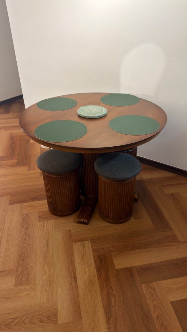 Solid wood round dining table (Category: Tables & Sets) located in Kuala Lumpur. Submitted by almarinik (Listing ID 1456066338, Image 2). Description: Selling my one year old dining table. Comes with 4 solid heavy wooden chair. Got defect during installation, accidentally used wrong screw and protruded a bit (last photo).