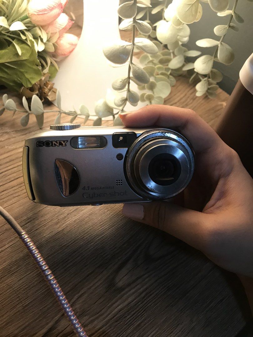 Sony Cyber-shot DSC-P100 Digital Camera (Category: Cameras) located in Paranaque City. Submitted by mozza_1 (Listing ID 1456220119, Image 2). Description: FOR PARTS ONLY / FOR ROOM DISPLAY - Sony Cyber-shot digital camera - 4.1 Megapixel resolution - Comes with a wrist strap .