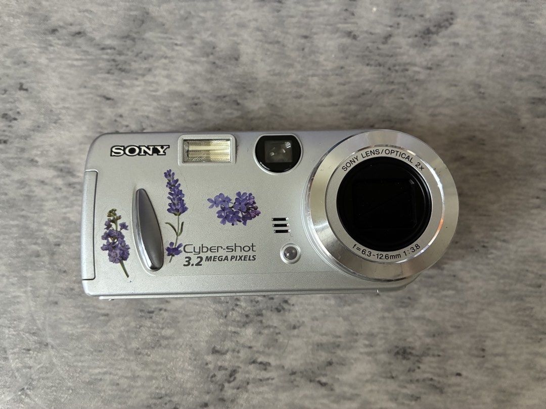 SONY CYBER-SHOT DSC-P52 DIGITAL CAMERA (Category: Cameras) located in Taguig. Submitted by kitssale (Listing ID 1456087610, Image 1). Description: SONY CYBER-SHOT DSC-P52 DIGITAL CAMERA 3.2MP ✅Released in July 2003 ✅Uses 2 pcs. Double A Battery FULLY FUNCTIONAL NO ISSUE INCLUSION: • Camera • 2GB Memory Card • Card Reader • Pouch RFS: Bought from La Memoria PH last August 9, 2026. I only used it during a weekend trip. .