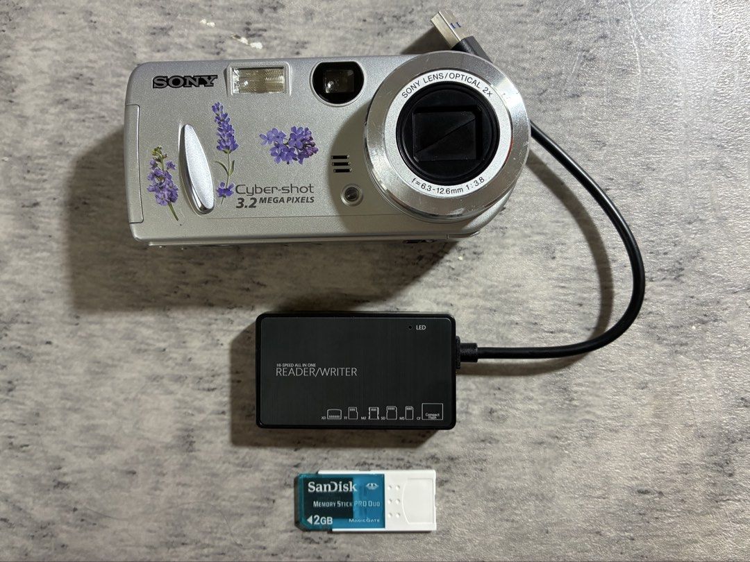 SONY CYBER-SHOT DSC-P52 DIGITAL CAMERA (Category: Cameras) located in Taguig. Submitted by kitssale (Listing ID 1456087610, Image 2). Description: SONY CYBER-SHOT DSC-P52 DIGITAL CAMERA 3.2MP ✅Released in July 2003 ✅Uses 2 pcs. Double A Battery FULLY FUNCTIONAL NO ISSUE INCLUSION: • Camera • 2GB Memory Card • Card Reader • Pouch RFS: Bought from La Memoria PH last August 9, 2026. I only used it during a weekend trip. .