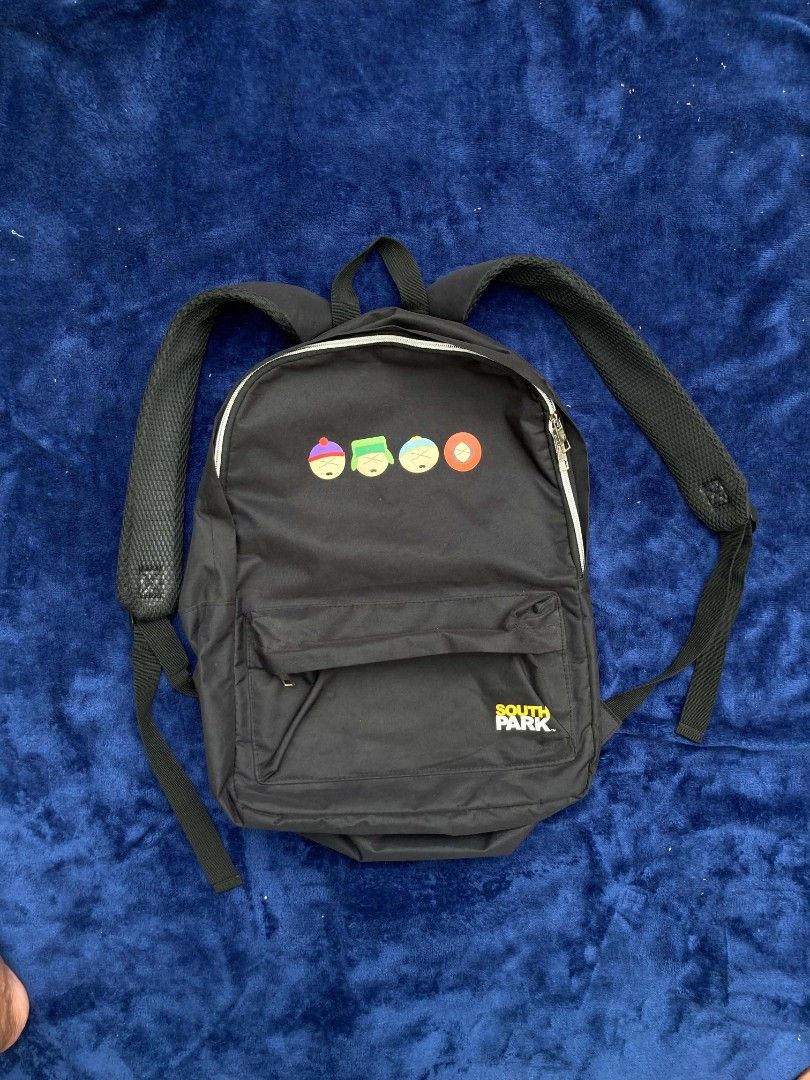 South Park Backpack (Category: Backpacks) located in Naga. Submitted by grunchieeeerr (Listing ID 1456109476, Image 1). Description: Cool black South Park backpack with character print. Features a fun character grid lining, front pocket, and adjustable straps. Perfect for school or daily use. 13.5x18 .
