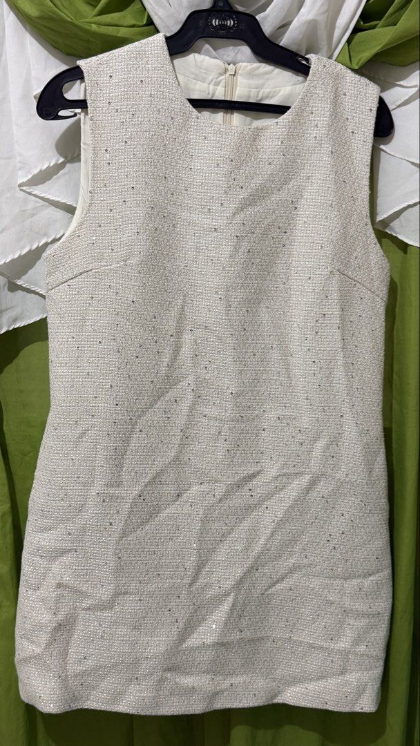 Sparkly Sleeveless Tweed Dress (Category: Dresses) located in Davao. Submitted by maemae0112 (Listing ID 1456120146, Image 1). Description: BUST 34 - Cream-colored sleeveless dress - Tweed-like texture - Scattered sequins for subtle sparkle - Zipper closure at the back - Ideal for parties or a night out.