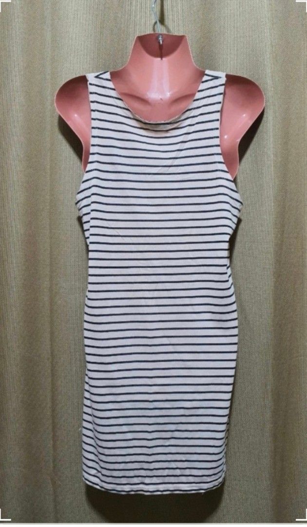 Striped Tank Top with Graphic Print (Category: Sleeveless) located in Manila. Submitted by phoebecali (Listing ID 1456193610, Image 3). Description: - White and navy striped tank top - Features a graphic print on the front - Sleeveless design - Scoop neckline - Soft and comfortable fabric - Ideal for casual wear - Pairs well with shorts or jeans - Size : Large - Condition : used 3x times only..No issues or whatsoever Taguig area 0917-240-46-48 MO