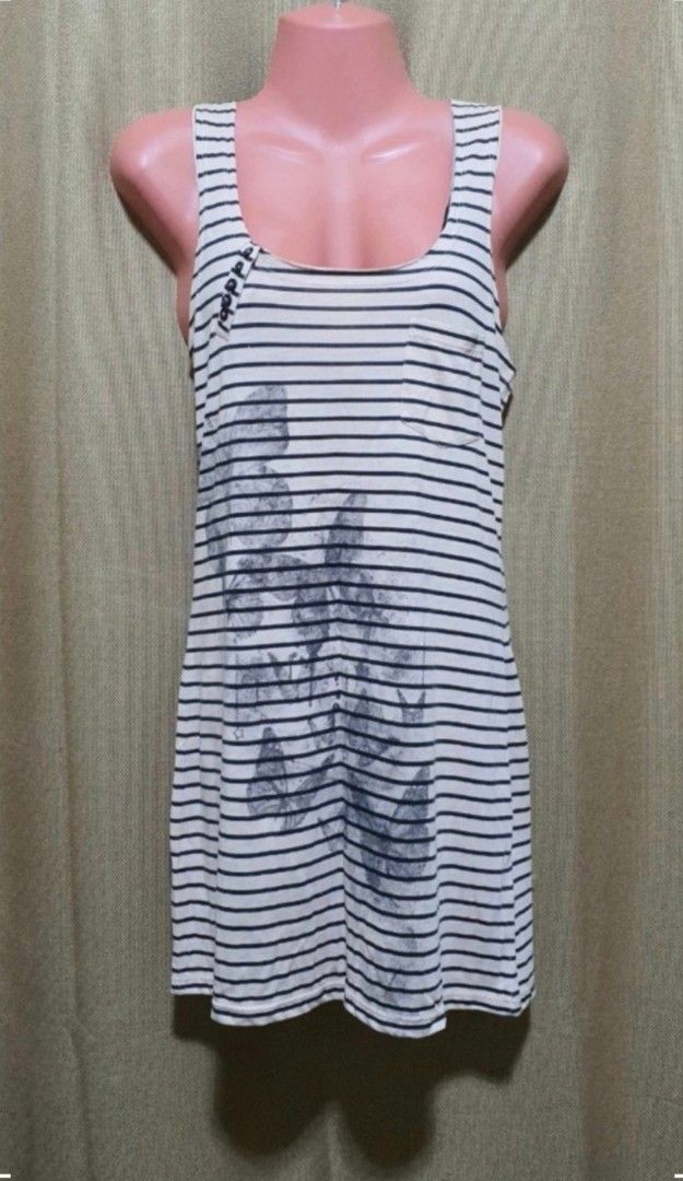 Striped Tank Top with Graphic Print (Category: Sleeveless) located in Manila. Submitted by phoebecali (Listing ID 1456193610, Image 2). Description: - White and navy striped tank top - Features a graphic print on the front - Sleeveless design - Scoop neckline - Soft and comfortable fabric - Ideal for casual wear - Pairs well with shorts or jeans - Size : Large - Condition : used 3x times only..No issues or whatsoever Taguig area 0917-240-46-48 MO