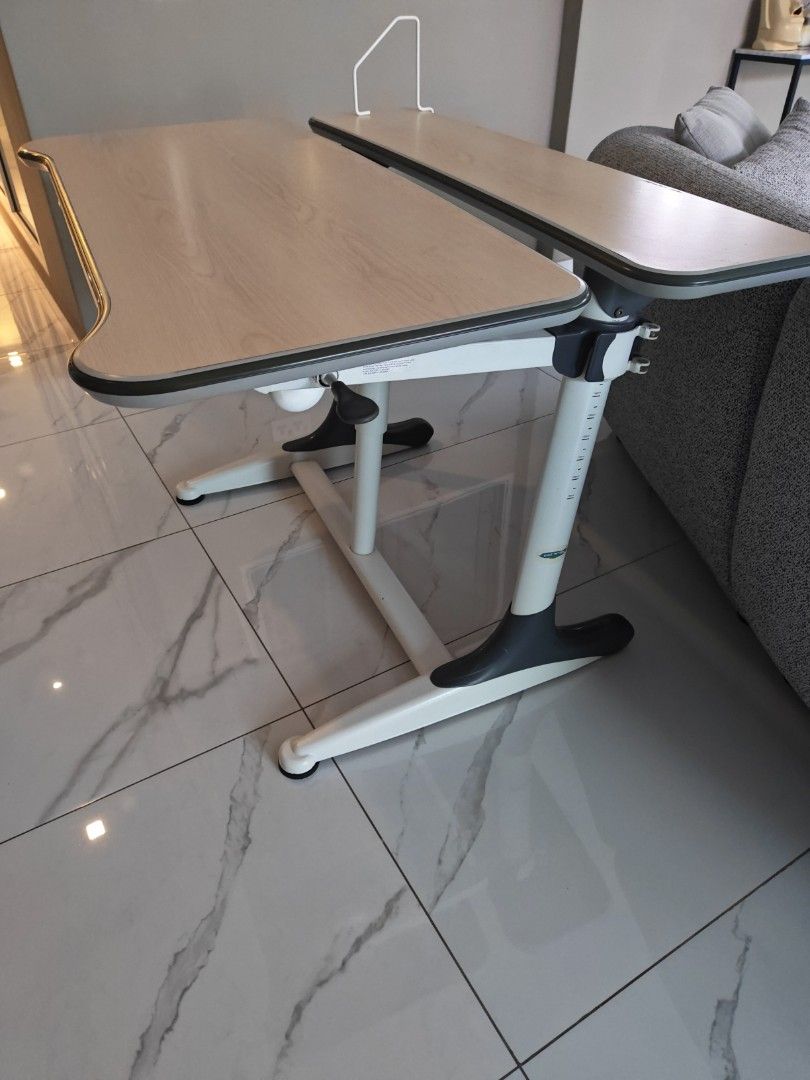 Study table for young ones (Category: Tables & Sets) located in Singapore. Submitted by awsomedeal (Listing ID 1456150310, Image 1). Description: - Adjustable study table designed for young learners. - Features height markings from 90cm to 140cm, allowing it to grow with your child. - Sturdy wooden tabletop, ideal for study and creative activities. - Simple and functional design. - Meetup available at Lorong Chuan..