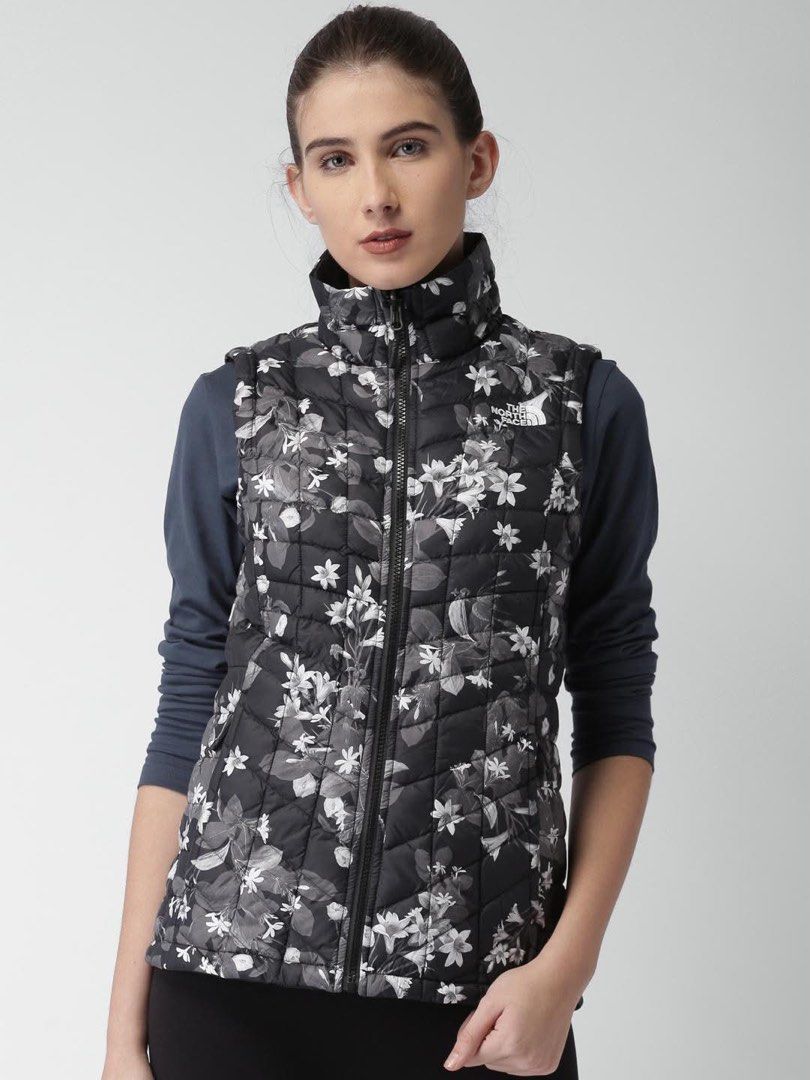 The North Face Floral packable Puffer Vest (Category: Vests) located in Baguio. Submitted by binibibi (Listing ID 1456020233, Image 2). Description: THE NORTH FACE THERMOBALL PRINTED PUFFER VEST (EXCELLENT CONDITION) SIZE XXL ON TAG BEST FIT LARGE - The North Face reversible puffer vest - Cool floral print on one side - Lightweight and packable - Drawstring hem for a snug fit - Ideal for layering and chilly weather.