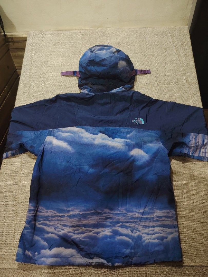 The North Face x CLOT Cloud Print Jacket (Category: Coats, Jackets and Outerwear) located in San Jose. Submitted by mickogapas67563 (Listing ID 1456136254, Image 2). Description: - The North Face cloud print jacket. - Unique cloud design. - Includes a hood and full zip closure. - Features North Face and CLOT logos. - Grey interior lining. - Men's size. 24 Width 29 length Excellent condition No issue.