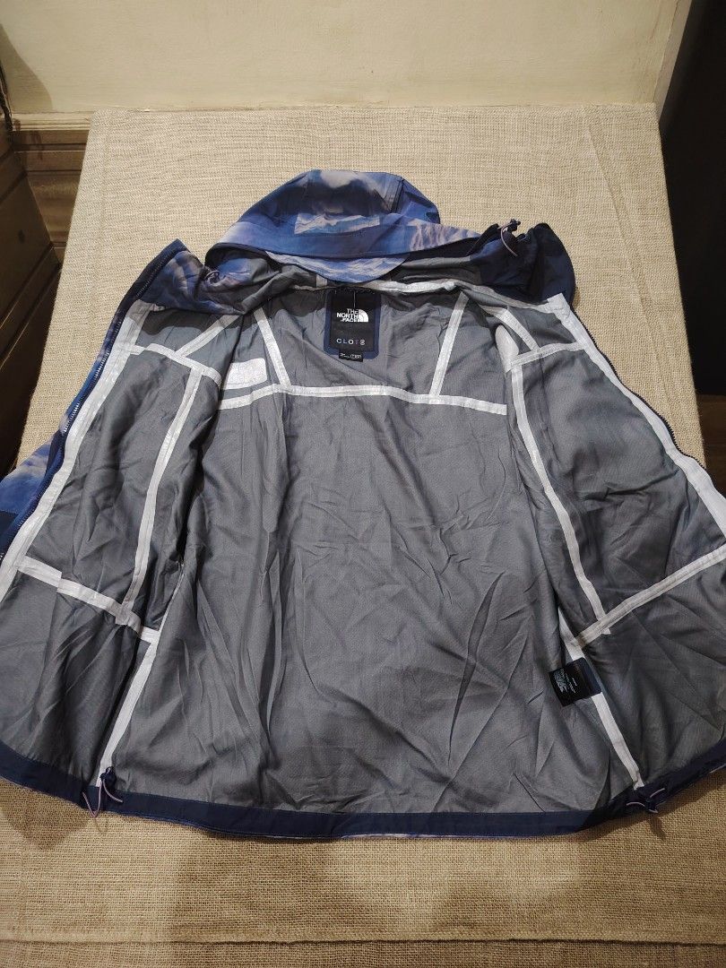 The North Face x CLOT Cloud Print Jacket (Category: Coats, Jackets and Outerwear) located in San Jose. Submitted by mickogapas67563 (Listing ID 1456136254, Image 3). Description: - The North Face cloud print jacket. - Unique cloud design. - Includes a hood and full zip closure. - Features North Face and CLOT logos. - Grey interior lining. - Men's size. 24 Width 29 length Excellent condition No issue.