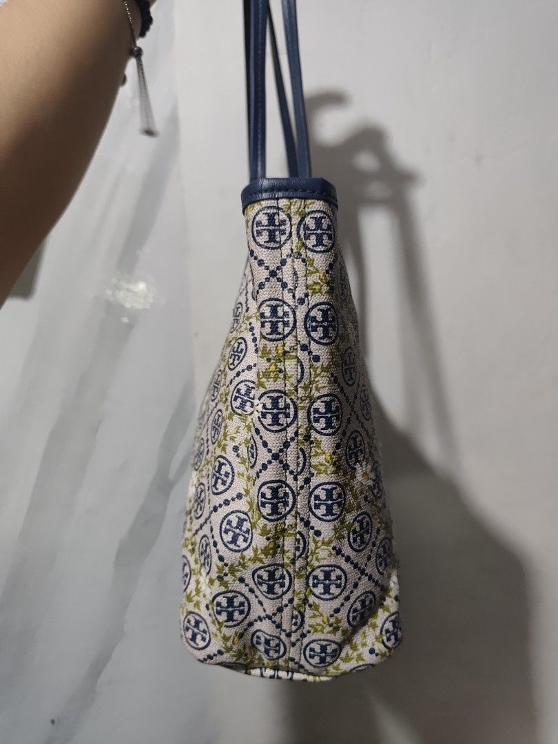 Tory Burch T Monogram Floral Vine Tote (Category: Tote Bags) located in Rizal. Submitted by chicout (Listing ID 1456208992, Image 3). Description: - Authentic Tory Burch tote bag - Features iconic logo pattern with a charming floral print - Stylish navy blue trim and handles - Ideal for everyday use - Spacious interior for all your essentials - Sign of use inly, see last picture for ref..