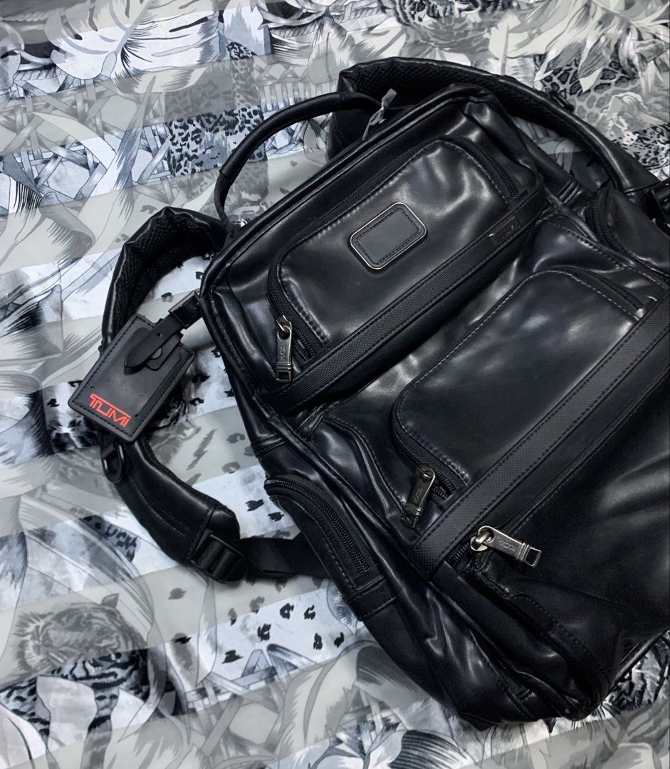 Tumi Black Leather Backpack with laptop compartment (Category: Luxury Bags & Wallets) located in Polomolok. Submitted by domingthriftclothes (Listing ID 1456187117, Image 2). Description: - Genuine Tumi black leather backpack - Multiple zippered compartments for excellent organization - Padded shoulder straps for maximum comfort - Comes with an authentic Tumi luggage tag - Spacious interior, ideal for travel or everyday essentials.