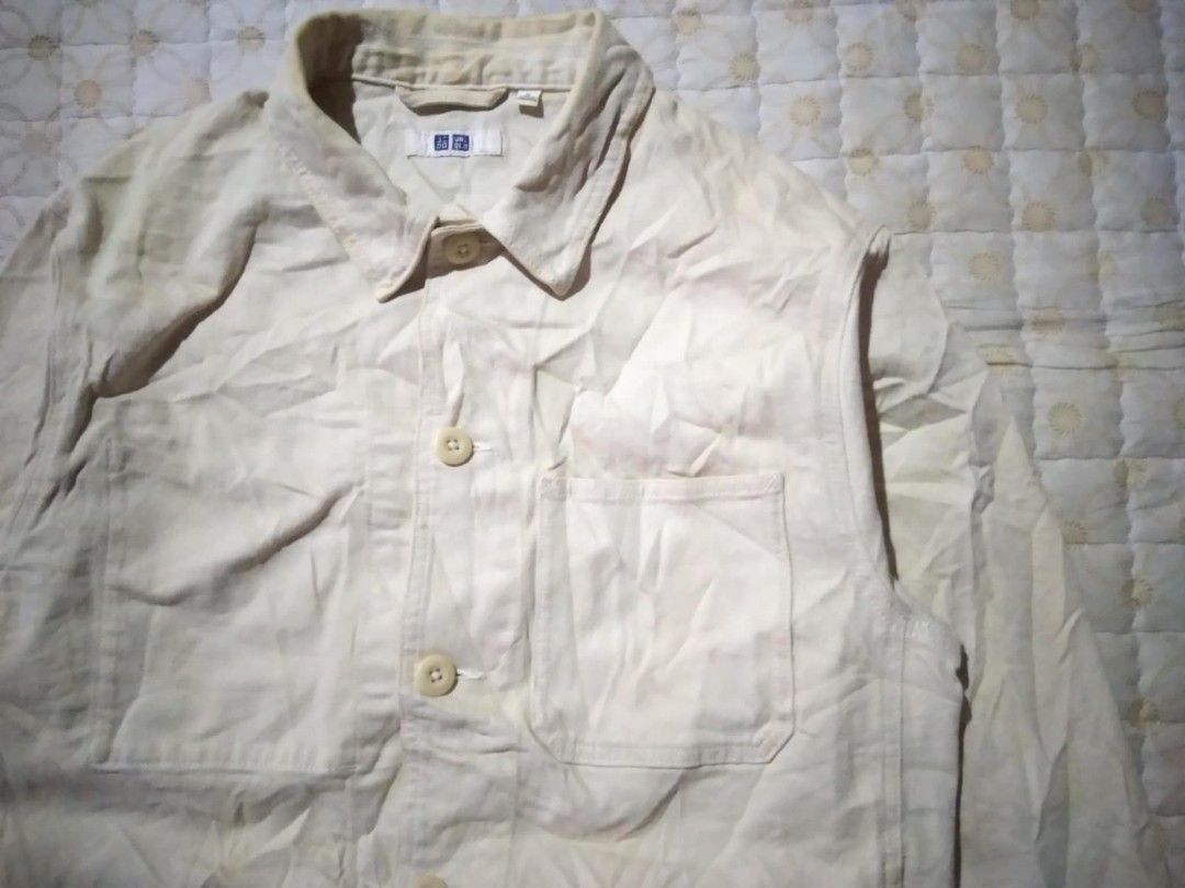 Uniqlo Beige Utility Chore Jacket Medium (Category: Coats, Jackets and Outerwear) located in Zamboanga. Submitted by nurbya898048 (Listing ID 1456148542, Image 2). Description: Uniqlo utility jacket in a light beige color. Features a classic workwear style silhouette with large front pockets. Button-up front with two chest pockets and two side pockets. Long sleeves with button cuffs.Tag size M. Great for layering. Dimesions; Width 21.5 Length 27 