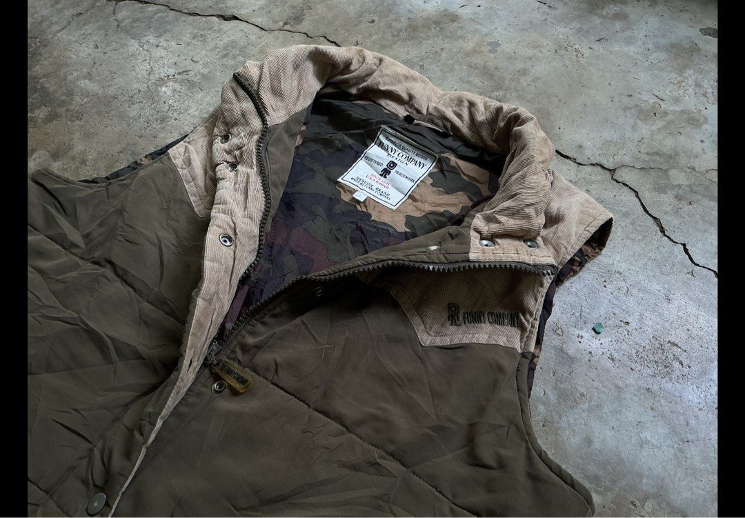 Vintage two tone Vest (Category: Coats, Jackets and Outerwear) located in San Pablo. Submitted by rushnthrift (Listing ID 1456172255, Image 2). Description: - vest in olive green and brown. - Vest features a stylish corduroy collar. - Interior lined with camouflage print. - Vest measurements: 20" wide, 22" long. - Ideal set for outdoor activities and adventures..