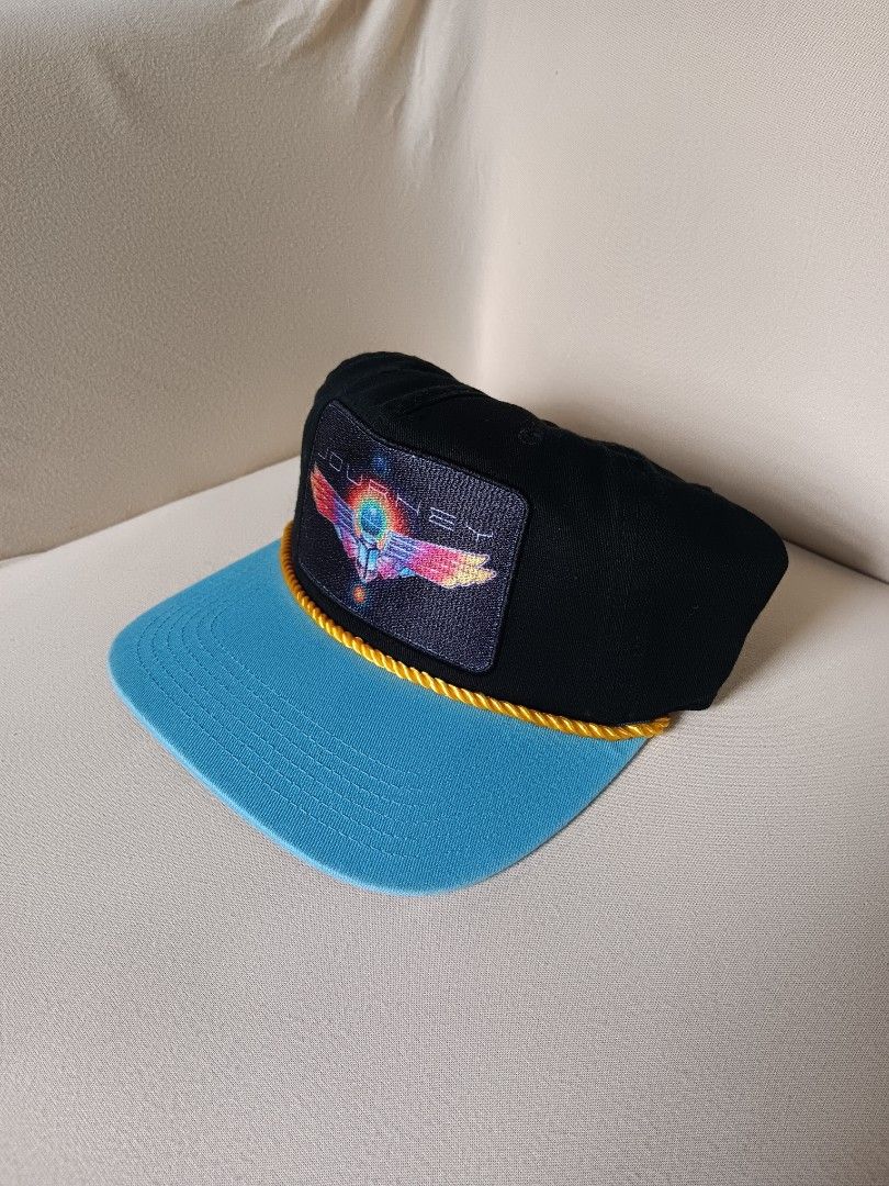 vintage Journey band trucker snapback hat (Category: Caps & Hats) located in Manila. Submitted by gerryanton77059 (Listing ID 1456072763, Image 2). Description: This is a vintage Journey band trucker snapback hat featuring a colorful embroidered scarab beetle and wings patch with a bright blue brim and yellow rope accent..