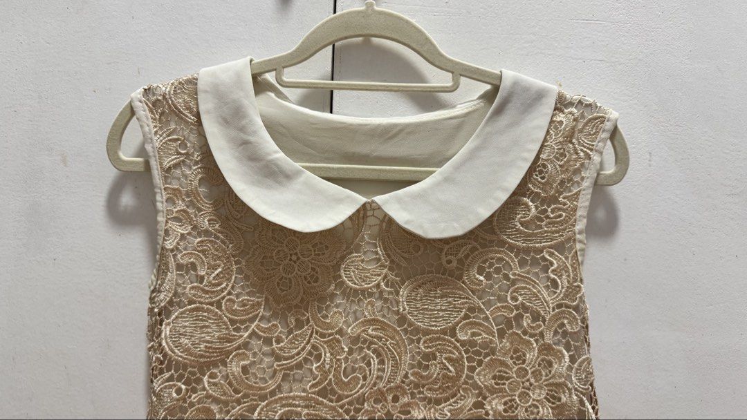 Vintage-Style Peter Pan Collar Lace Blouse (Category: Blouses) located in Taguig. Submitted by kia______ (Listing ID 1456083980, Image 2). Description: An elegant sleeveless top featuring intricate champagne/gold embroidered paisley-floral lace overlay with a contrasting white Peter Pan collar and soft inner lining. Great for semi-formal events, workwear layering, or classy casual outfits. Style: Sleeveless lace blouse / Peter Pan collar top Deta