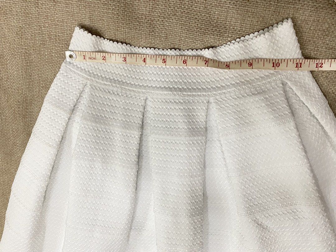 White Pleated Textured A-Line Skirt (Category: Skirts) located in Taguig. Submitted by wena11 (Listing ID 1456151786, Image 3). Description: - White A-line skirt - Textured fabric with subtle wave pattern - Pleats at the waist - Scalloped hemline Fits XS-S ***Get 1 item for FREE. Choose 1 from my listings priced Php 0/FREE..