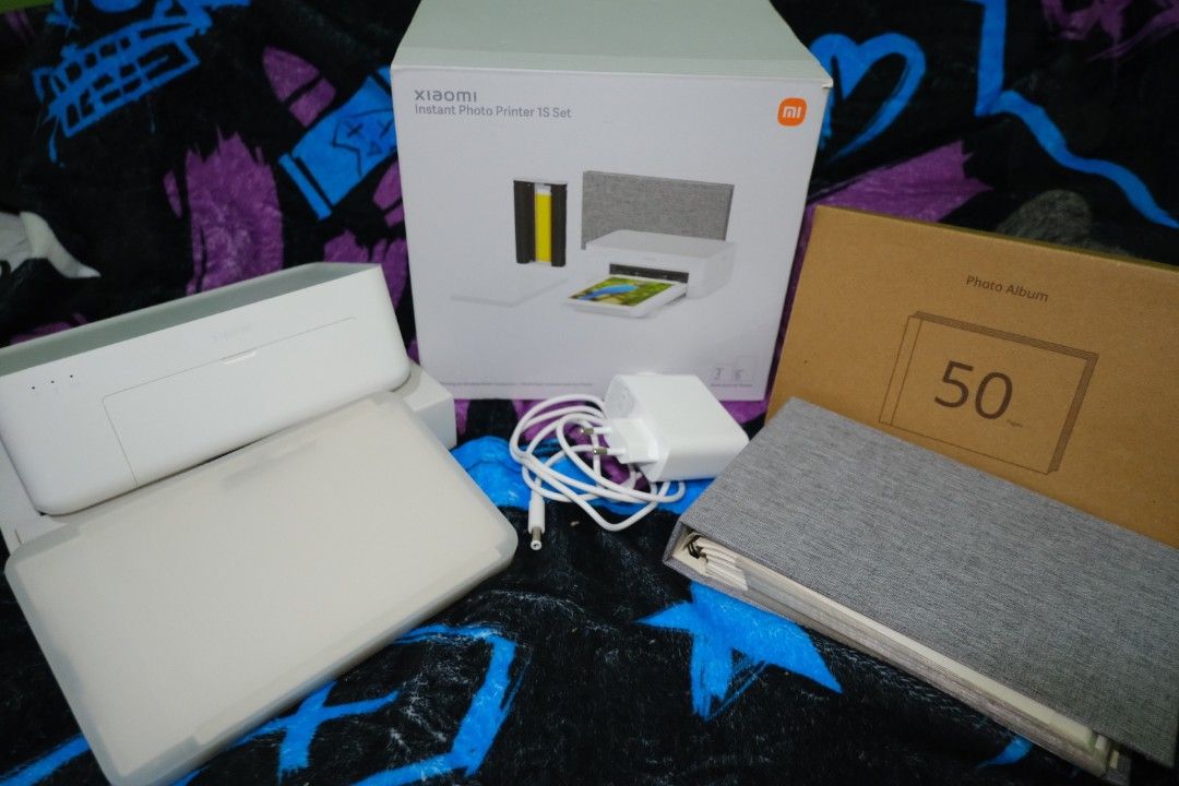 Xiaomi Instant Photo Printer 1S Set (Category: Printers, Scanners & Copiers) located in Bacoor. Submitted by sidequestbypretz (Listing ID 1456099964, Image 2). Description: - Xiaomi Instant Photo Printer 1S Set - Prints both 3" and 6" photos - Wireless direct connection for easy printing - Charger included - Ideal for capturing and printing memories on the go -No photo paper.