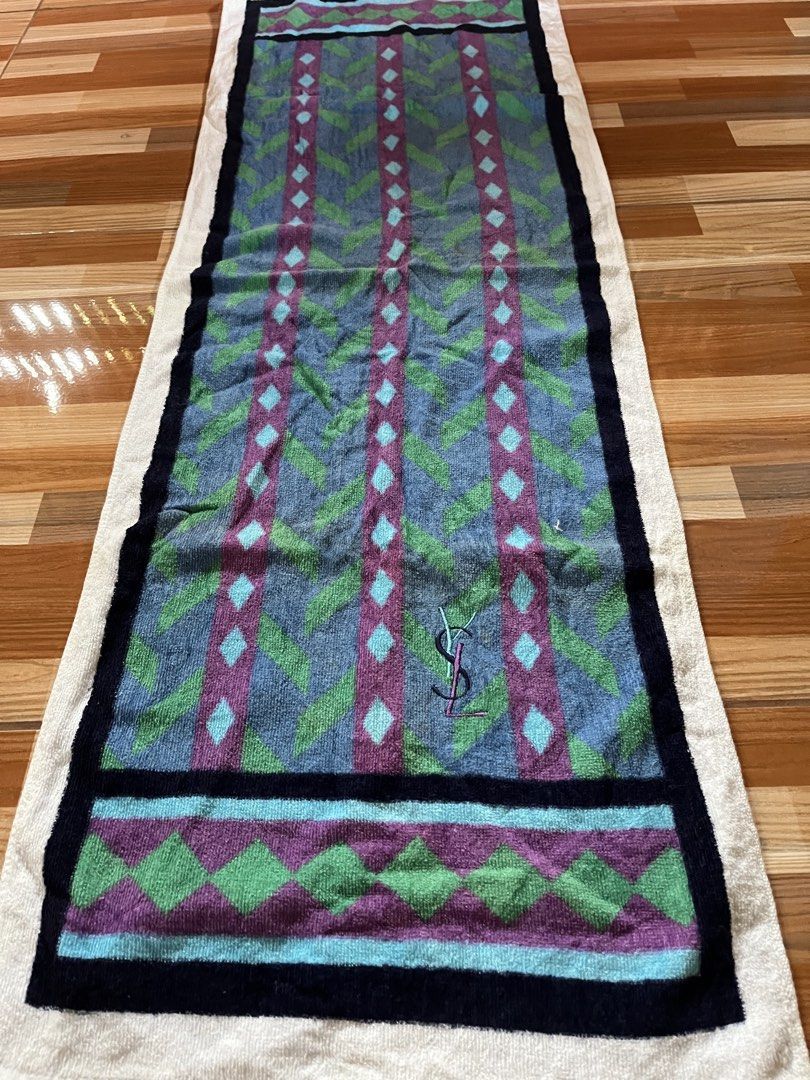 Yves Saint Laurent YSL Monogram Towel (Category: Luxury Apparel) located in Nabua. Submitted by lastthrift2.0 (Listing ID 1456074181, Image 2). Description: Dimes•length 39,width 13 - Authentic YSL towel - Features iconic YSL monogram - Geometric pattern design - Soft and absorbent material - Perfect for gym, beach, or home use - Approximate dimensions: 40cm x 100cm - Made in China.
