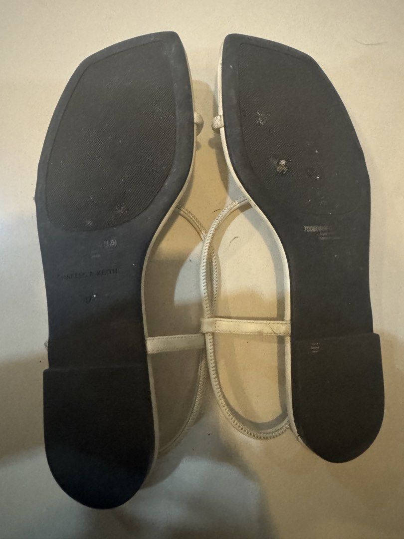 37 Charles & Keith White Strappy Flat Sandals Size 37 (Category: Flats & Sandals) located in Manila. Submitted by decluterthings888 (Listing ID 1456360179, Image 3). Description: - Brand: Charles & Keith - Color: White - Style: Strappy sandals - Toe Shape: Square toe - Features: Adjustable ankle strap - Condition: Soles show some wear - Occasion: Great for casual outings.