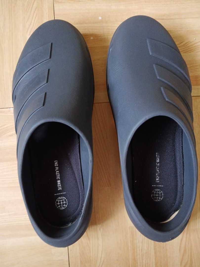 Adidas Adilette Clogs Dark Grey (Category: Looking For) located in San Pedro. Submitted by JohnsonKeeps (Listing ID 1456261185, Image 1). Description: - Adidas dark grey slip-on clogs - Men's size: 30-31 cm / 11-12 inches - Made with recycled materials (features 'End Plastic Waste' label) - Wavy tread pattern on sole for enhanced grip - Ideal for casual outings or comfortable home wear.