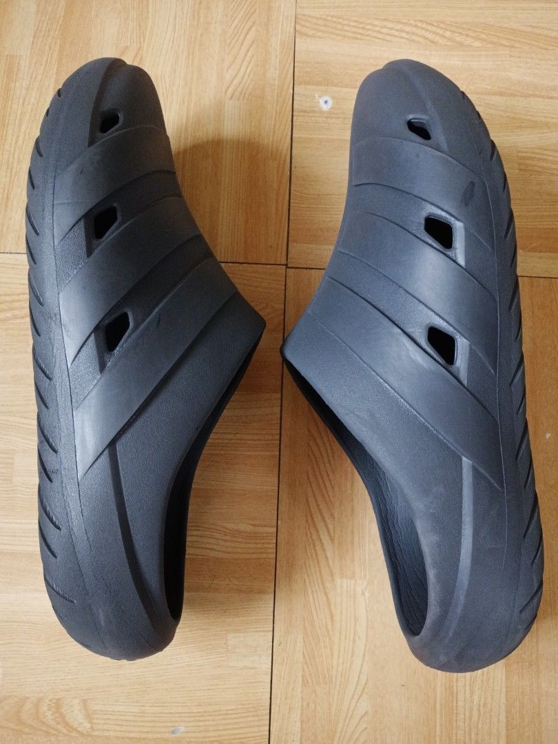 Adidas Adilette Clogs Dark Grey (Category: Looking For) located in San Pedro. Submitted by JohnsonKeeps (Listing ID 1456261185, Image 2). Description: - Adidas dark grey slip-on clogs - Men's size: 30-31 cm / 11-12 inches - Made with recycled materials (features 'End Plastic Waste' label) - Wavy tread pattern on sole for enhanced grip - Ideal for casual outings or comfortable home wear.