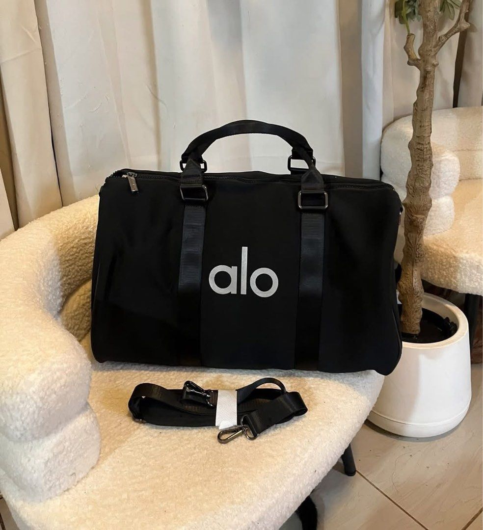 Alo Duffle Bag Black (Category: Cross-body Bags) located in Manila. Submitted by lovekara (Listing ID 1456318419, Image 1). Description: Height: 28cm Width : 21cm Length : 43cm .