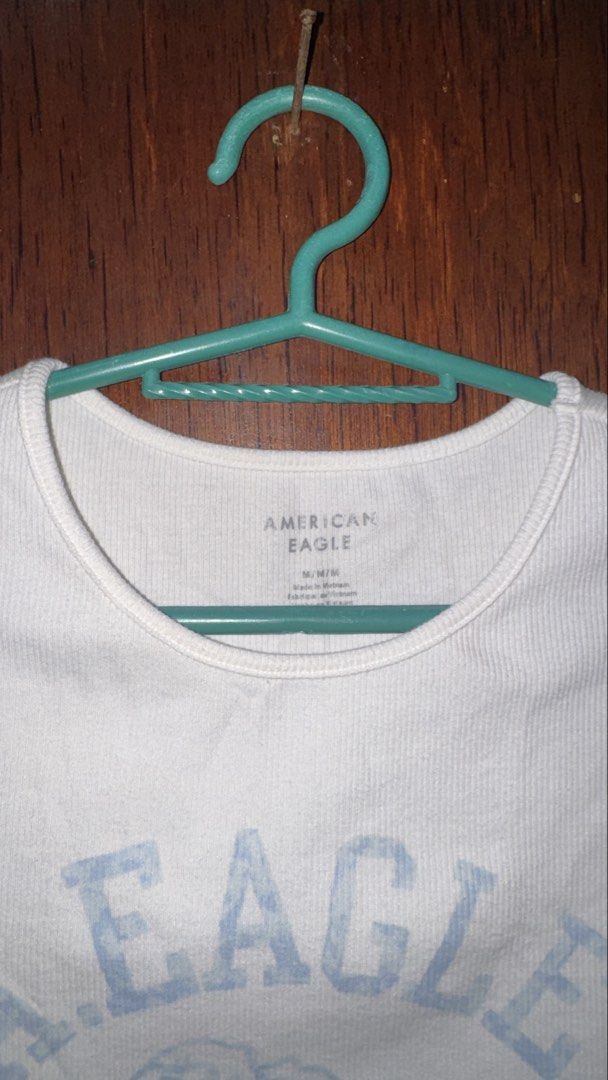 American Eagle White T-shirt with Rose Graphic (Category: Shirts) located in Quezon City. Submitted by trishasm (Listing ID 1456398445, Image 2). Description: [SIZE: M] Slightly used. Delivery fee shouldered by buyer..