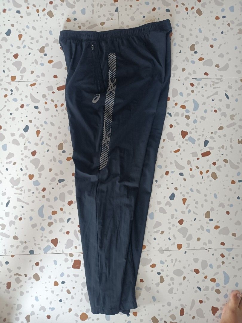 ASICS Running Pants XL (Category: Activewear) located in Zamboanga. Submitted by caps_luck (Listing ID 1456397922, Image 2). Description: - ASICS running pants - Size: XL - Reflective detailing on sides - Two zippered pockets - Elastic waistband with drawstring - Made in Vietnam - Ideal for workouts or casual wear.