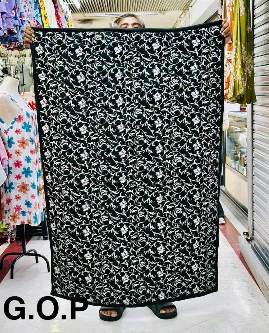 Assorted Design Quilts/Blankets - Red, Black, Green (Category: Bedding & Towels) located in Manila. Submitted by marvieobordo (Listing ID 1456265882, Image 2). Description: - Set of 4 vibrant quilts or blankets. - Designs include: red geometric, black floral, red leaf motif, and green Christmas poinsettia. - Perfect for adding color or cozy nights. - All approximately the same size..