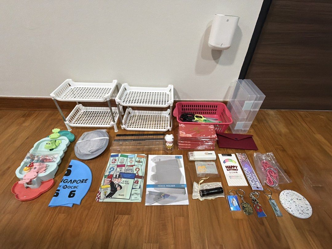 Assorted stuff (Category: Home Improvement Tools & Accessories) located in Singapore. Submitted by kandysh (Listing ID 1456357380, Image 2). Description: 2 pack birthday candles, foldable pen holder, 3pcs A5 folders, 6 packs Ang baos, foldable laundry basket, 2 monitor shelf, 4 key chains, pop mart figurine, toy, swim cap, 2 double layer shelf, storage basket, 8 scissors (big and small), 1 peeler, velvet pouch, coaster, 1 pack of hooks, 2 A5 size