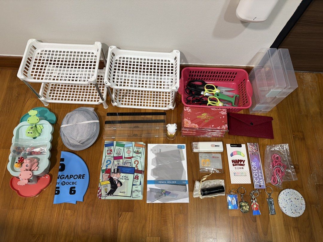Assorted stuff (Category: Home Improvement Tools & Accessories) located in Singapore. Submitted by kandysh (Listing ID 1456357380, Image 1). Description: 2 pack birthday candles, foldable pen holder, 3pcs A5 folders, 6 packs Ang baos, foldable laundry basket, 2 monitor shelf, 4 key chains, pop mart figurine, toy, swim cap, 2 double layer shelf, storage basket, 8 scissors (big and small), 1 peeler, velvet pouch, coaster, 1 pack of hooks, 2 A5 size