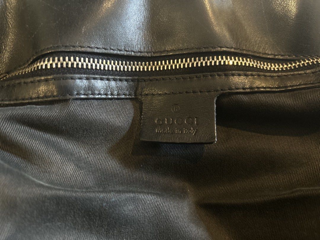 (Authentic) Gucci GG Canvas Belted Tote Bag (Category: Luxury Bags & Wallets) located in San Jose del Monte. Submitted by declutteriri (Listing ID 1456285987, Image 3). Description: Text me for inquiries. I cant see Carousell messages. I used this as a school bag and it fits my laptop. Brand: Gucci Style: Tote / Shoulder Bag Color: Black Material: GG Monogram Canvas with Leather Trim Hardware: Silver-tone Closure: Open top with strap/buckle accen