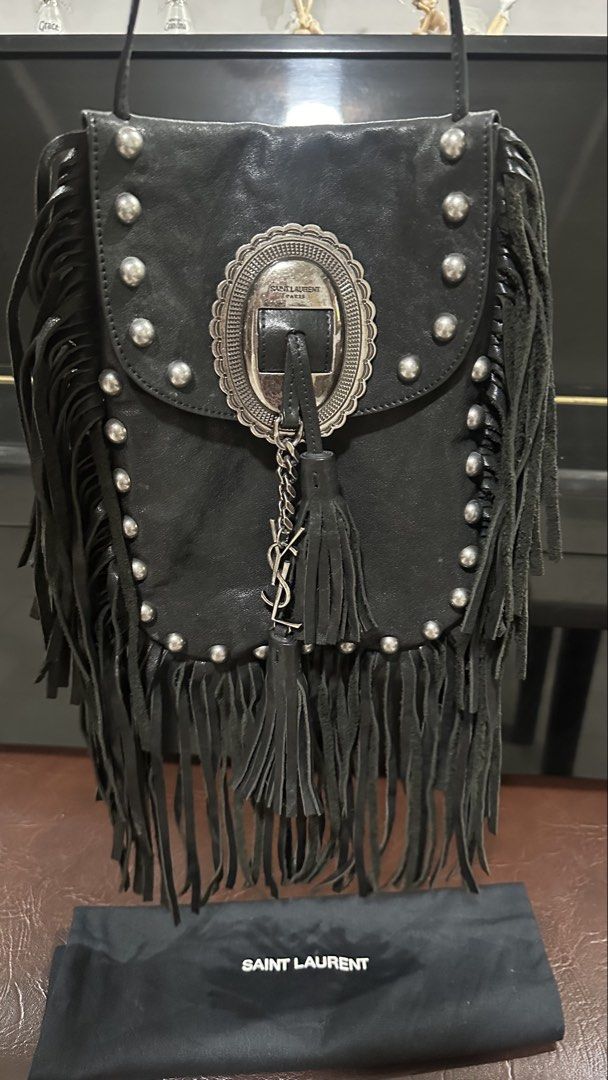 Authentic YSL Fringe Tassel Sling Bag (Category: Luxury Bags & Wallets) located in Las Pinas. Submitted by marshmallowmax (Listing ID 1456347426, Image 1). Description: Slightly used but missing 1 stud under flap-refer photo Fits big size phones With dustbag.