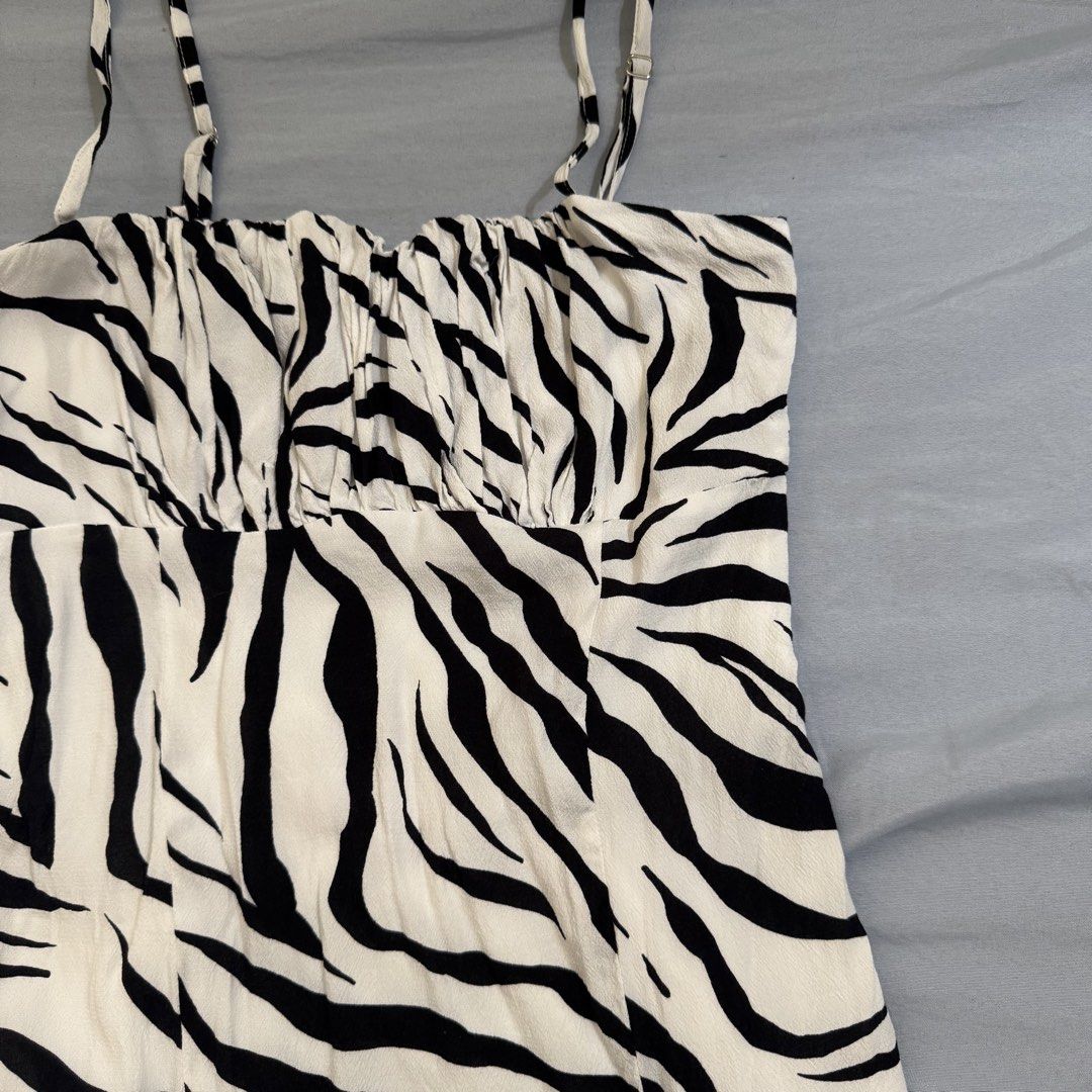 Bershka Ruched Mini Dress (Category: Dresses) located in Cagayan de Oro. Submitted by kheyx (Listing ID 1456267878, Image 2). Description: - zebra print mini dress from Bershka - Size S - Features a ruched bust - Adjustable spaghetti straps - Lightweight and flowy fabric - Perfect for nights out or casual wear - Brand new, never worn above knee length side zipper.