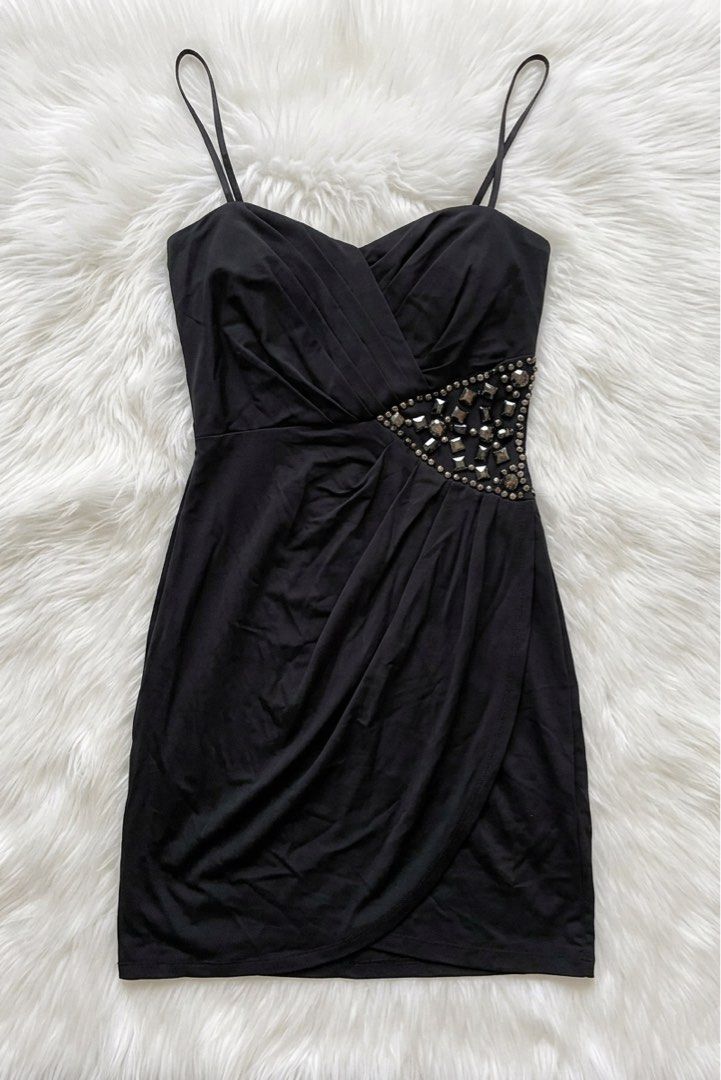 Black Embellished Mini Dress with Straps (Category: Dresses) located in Manila. Submitted by krxtn.dnl (Listing ID 1456376522, Image 1). Description: - Elegant black mini dress - Sweetheart neckline with spaghetti straps - Flattering ruched bodice - Glamorous jeweled accent on the side waist - Stylish draped tulip hem skirt - Ideal for a night out or party occasion.