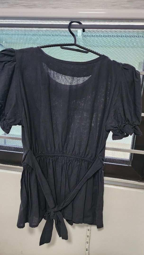 Black Puff Sleeve Peplum Top with Buttons (Category: Blouses) located in Manila. Submitted by trueeagle_5e163a (Listing ID 1456393543, Image 2). Description: - Elegant black top - Stylish puff sleeves - Flattering gathered waist - Chic peplum hem - Three white buttons down the front - Adjustable ties at the back - Fabric with a subtle sheen - Chest measurement: approximately 15 inches -preloved 🌿 Pay via Gcash, Maya, Gotyme 🌿 Shipping care of b