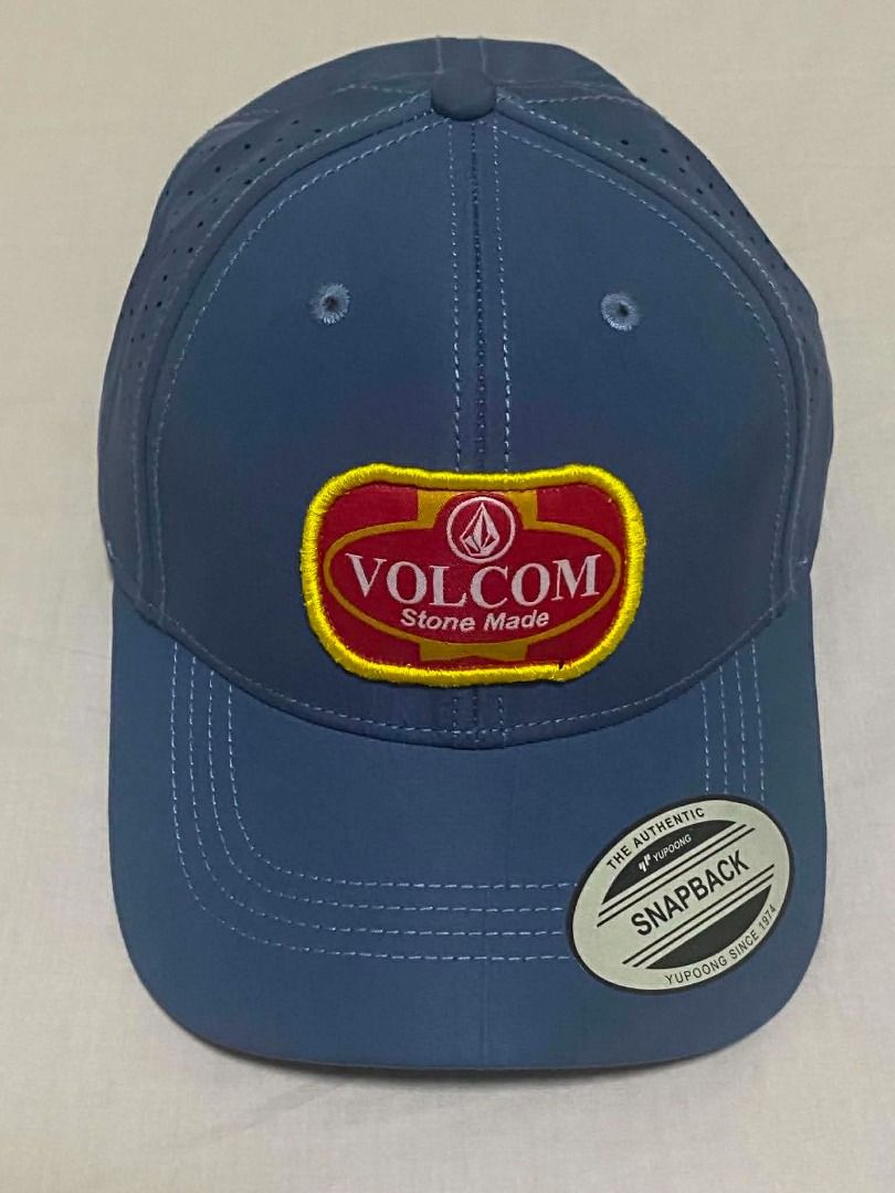 Blue Volcom Stone Made Snapback Cap - Yupoong Authentic (Perforated Panels). (Category: Caps & Hats) located in Quezon City. Submitted by carlos132 (Listing ID 1456346614, Image 1). Description: Embroidered/woven patch logo - durable, not printed. - Perforated panels for airflow - ideal for tropical weather. - Snapback adjustable closure - one size fits most. - Yupoong Since 1974 tag confirms build quality. .