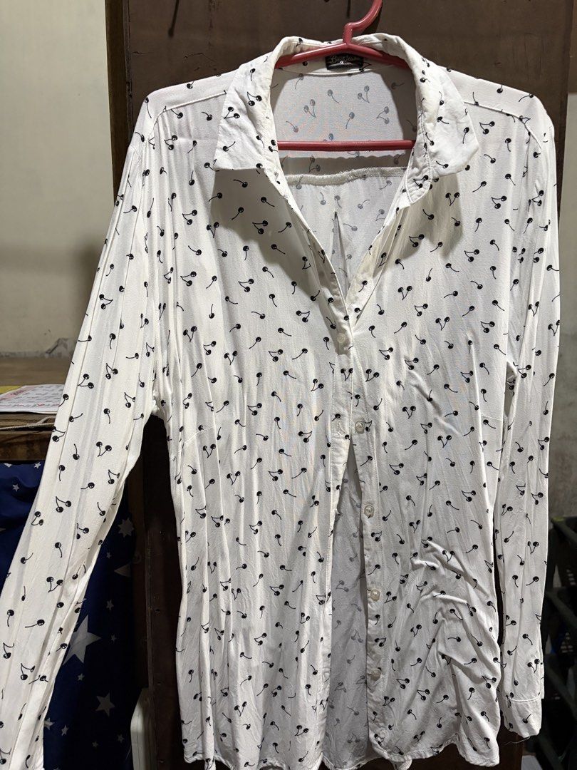 BNY Jeans White Cherry Print Button Up Shirt (Category: Shirts) located in Quezon City. Submitted by micaaaay (Listing ID 1456260993, Image 1). Description: - White button-up shirt - Adorable all-over black cherry print - Long sleeves - Lightweight fabric - Versatile for casual outfits or layering - Pairs well with jeans or skirts.