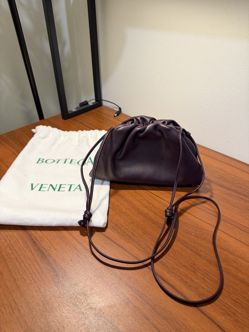 Bottega Veneta The Pouch Mini Plum (Category: Luxury Bags & Wallets) located in Pasig City. Submitted by marcodoge (Listing ID 1456360441, Image 1). Description: 100% Authentic! Retails for 140k+ • Soft and rounded frame clutch in smooth butter leather • Lined in nappa for a clean finish • Logo is discreetly embossed inside • Includes original dustbag Very versatile since sling can shortened. Can be worn crossbody, over the shoulder, or as a clut