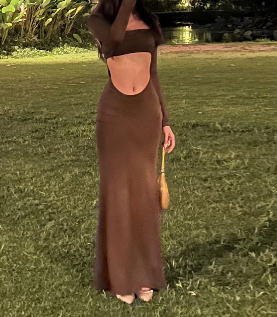Brown Cut-out Maxi Dress (Category: Dresses) located in Angeles City. Submitted by stealmyfit (Listing ID 1456299612, Image 1). Description: - Long sleeve maxi dress - Features a stylish waist cut-out detail - Fabric has a beautiful drape - Ideal for night outs or special occasions - Pairs perfectly with heels and a clutch.