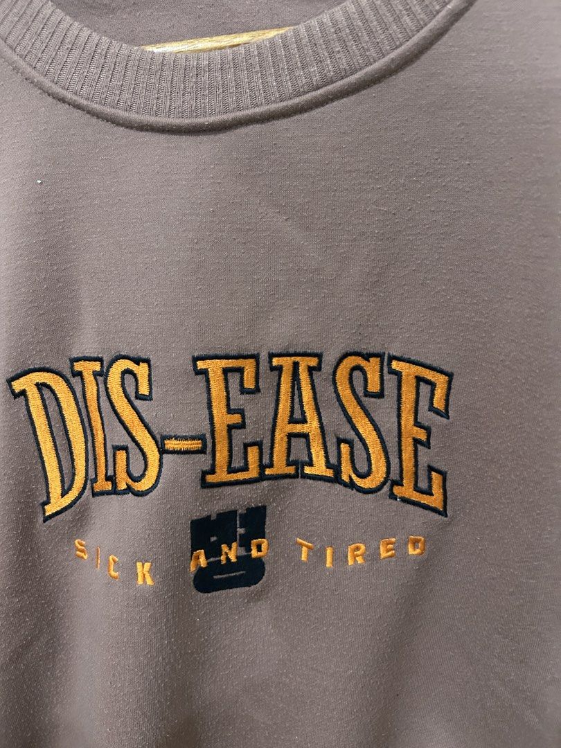BTS "DIS-EASE SICK AND TIRED" Graphic Sweatshirt (Category: Longsleeves) located in Manila. Submitted by kxkcx (Listing ID 1456376403, Image 2). Description: - Brown sweatshirt with "DIS-EASE SICK AND TIRED" graphic - Crew neck, long sleeves - Ribbed cuffs and hem for a snug fit - Comfortable and casual, ideal for everyday wear - Easy to pair with jeans or shorts - A simple statement piece for your wardrobe.