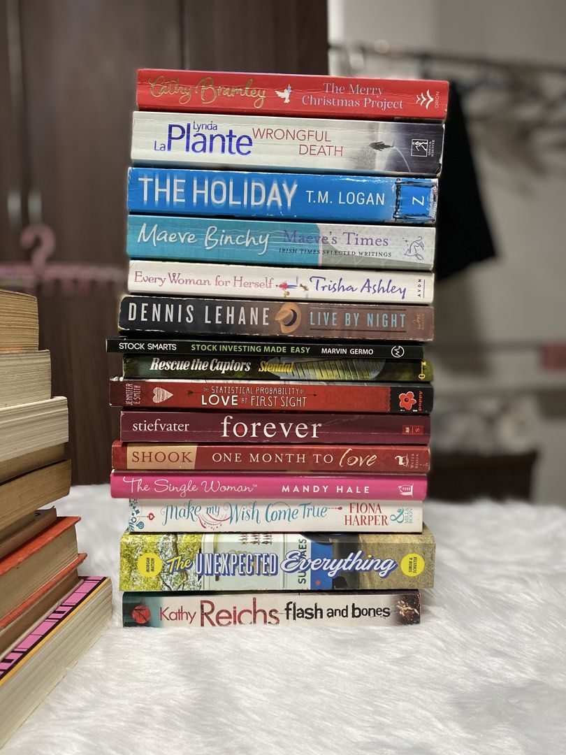 Bundle of Assorted Fiction Books - Various Authors (Category: Storybooks) located in Meycauayan. Submitted by _preloveddstuff (Listing ID 1456385009, Image 1). Description: - Bundle of fiction books featuring authors like Cathy Stanley, Lynda Plante, T.M. Logan, Maeve Binchy, Trisha Ashley, Dennis Lehane, Marvin Germo, Spencer Jordan, and Cecelia Ahern. - A great collection for avid readers. - Includes a mix of older and newer titles. - All books