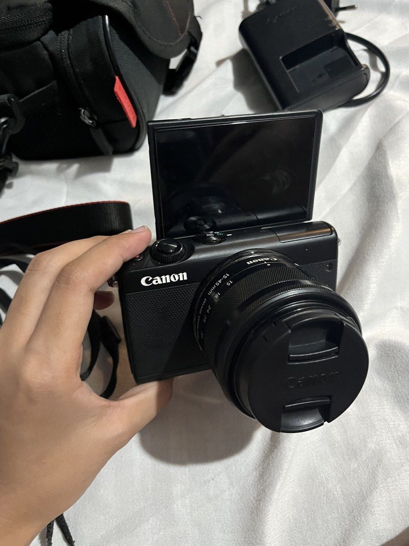 Canon EOS M100 (Category: Cameras) located in San Jose del Monte. Submitted by declutterwithmichi (Listing ID 1456415456, Image 2). Description: Canon EOS M100 Mirrorless Camera Selling my Canon EOS M100 — perfect for beginners, content creators, travel, and everyday photography! 🤍 NO ISSUE! 28k nego :) Details: • 24.2MP APS-C sensor • Compact & lightweight • Flip-up LCD screen — great for selfies/vlogging • Built-in Wi-Fi & Bluetooth • Intercha