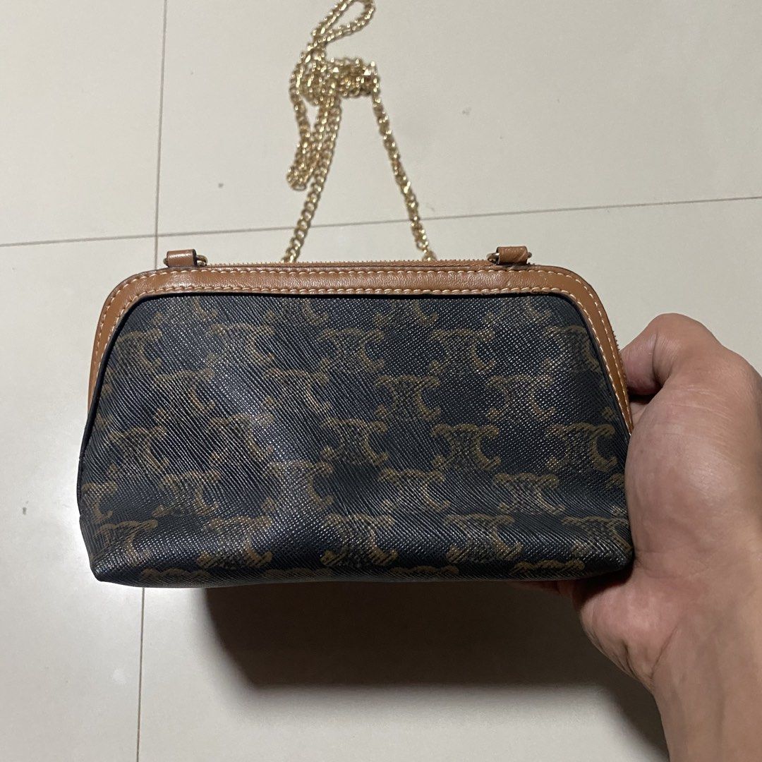 Celine Triomphe Canvas Shoulder Bag (Category: Luxury Bags & Wallets) located in Zamboanga. Submitted by thriftyyali (Listing ID 1456410169, Image 2). Description: - Authentic Celine pouch bag in iconic Triomphe canvas. - Chic brown and tan colorway. - Features a stylish gold chain strap. - Secure zipper closure. - Ideal size for carrying your essentials (approx. 7" L x 4" H)..