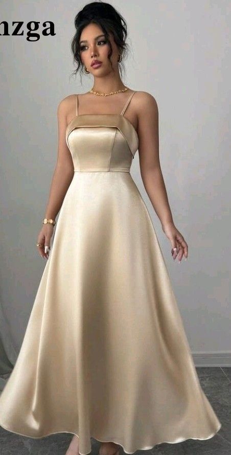 Champagne Satin Spaghetti Strap Long Dress (Category: Dresses) located in San Pedro. Submitted by JohnsonKeeps (Listing ID 1456307286, Image 1). Description: - Elegant Champagne Satin long dress - Spaghetti straps - Zipper closure at the back - Fabric has a beautiful sheen - Ideal for events and parties - Size: Large (L).