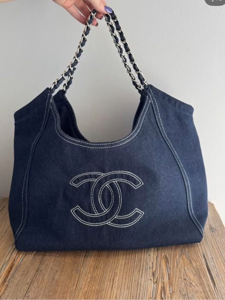 Chanel Denim tote bag GWP (Category: Luxury Bags & Wallets) located in Manila. Submitted by notsospicyyyy (Listing ID 1456384410, Image 1). Description: - Classic Chanel GWP - Material: Dark wash denim - Iconic stitched CC logo on front - Double chain straps with denim accents - Spacious interior, ideal for daily use - A stylish and versatile addition to any outfit.