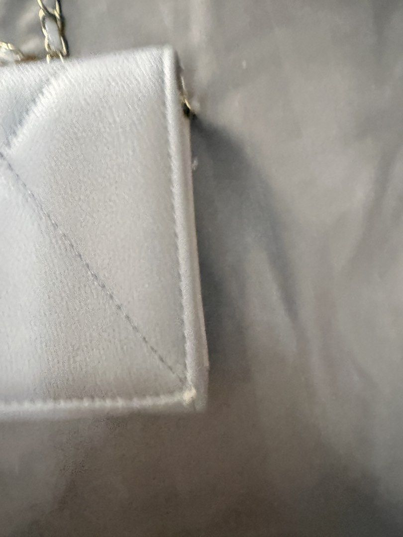 Chanel Grey Quilted Wallet on Chain Bag (Category: Luxury Bags & Wallets) located in Antipolo. Submitted by bangtancarteu_ (Listing ID 1456237272, Image 2). Description: - Chanel Wallet on Chain (WOC) - Color: Grey - Iconic quilted exterior - Signature gold CC logo - Interior: Multiple card slots and zippered compartment - Gold chain strap with leather detailing - Condition: Minor wear on corners - Ideal for carrying essentials.