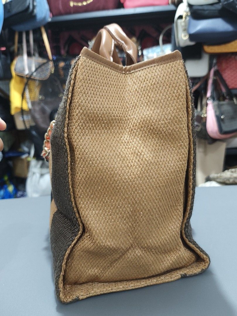 Chanel Paris Striped Canvas Tote Bag (Category: Luxury Bags & Wallets) located in Bulacan. Submitted by abejeroamy80846 (Listing ID 1456362039, Image 3). Description: - Chanel tote bag - Chic woven striped pattern in brown and black - "CHANEL PARIS" lettering and iconic CC logo detail - Comfortable leather handles and stylish chain strap - Spacious interior, perfect for everyday or travel.