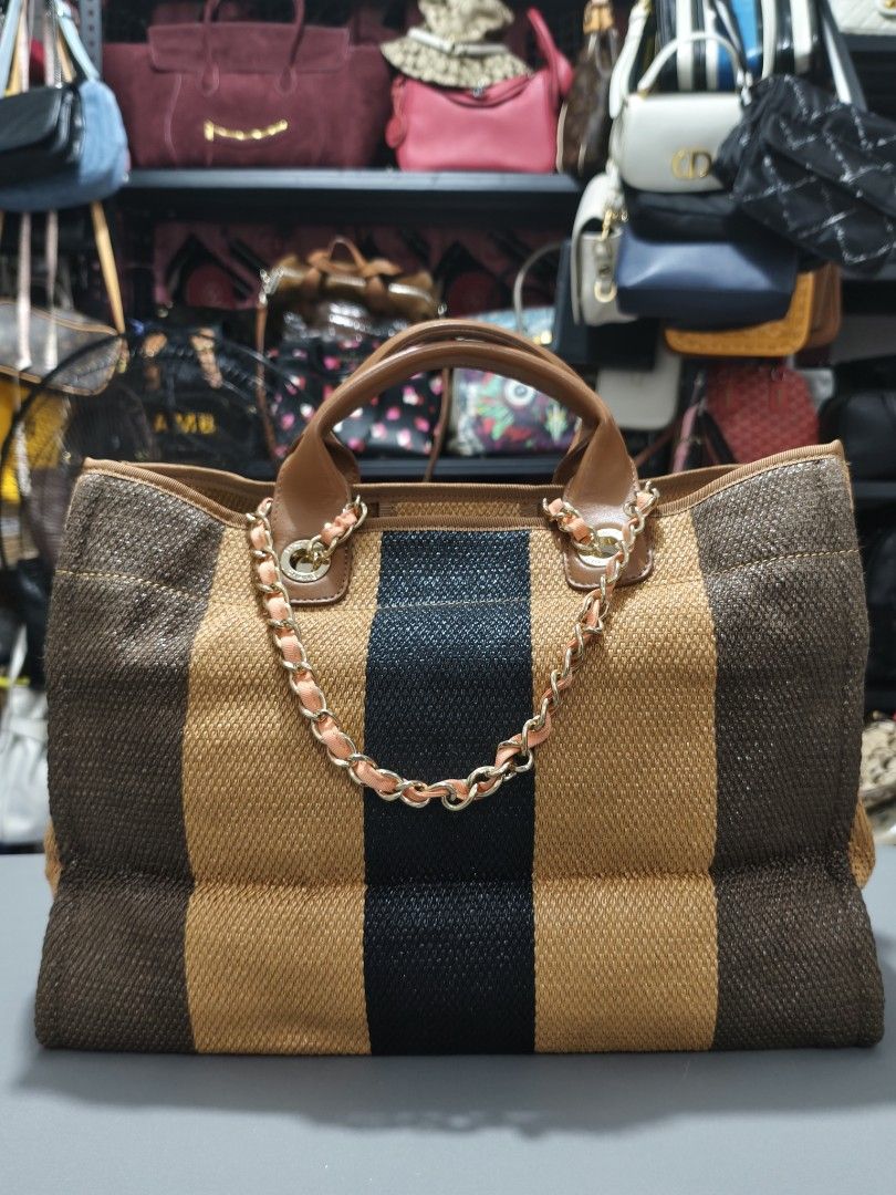 Chanel Paris Striped Canvas Tote Bag (Category: Luxury Bags & Wallets) located in Bulacan. Submitted by abejeroamy80846 (Listing ID 1456362039, Image 2). Description: - Chanel tote bag - Chic woven striped pattern in brown and black - "CHANEL PARIS" lettering and iconic CC logo detail - Comfortable leather handles and stylish chain strap - Spacious interior, perfect for everyday or travel.